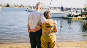 couple standing by water